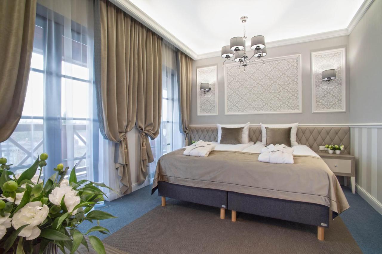 تشيخوتشينيك Boutique Odyseja & Spa المظهر الخارجي الصورة A bedroom in the hotel