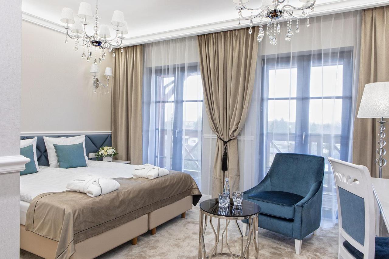 تشيخوتشينيك Boutique Odyseja & Spa المظهر الخارجي الصورة A bedroom in the hotel